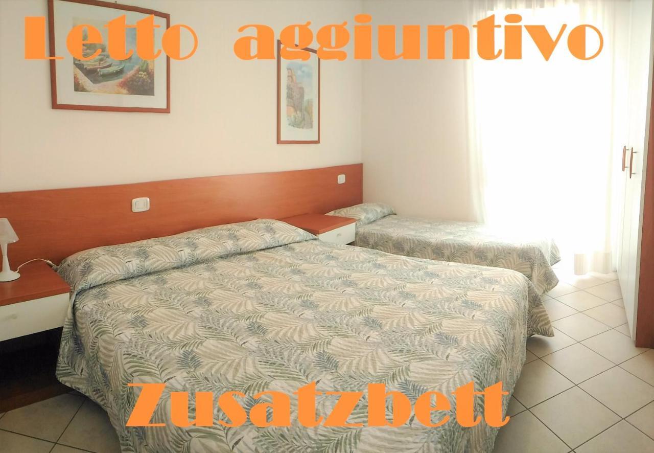 Green Holiday Wohnung Mit Schwimmbad Bibione Bagian luar foto